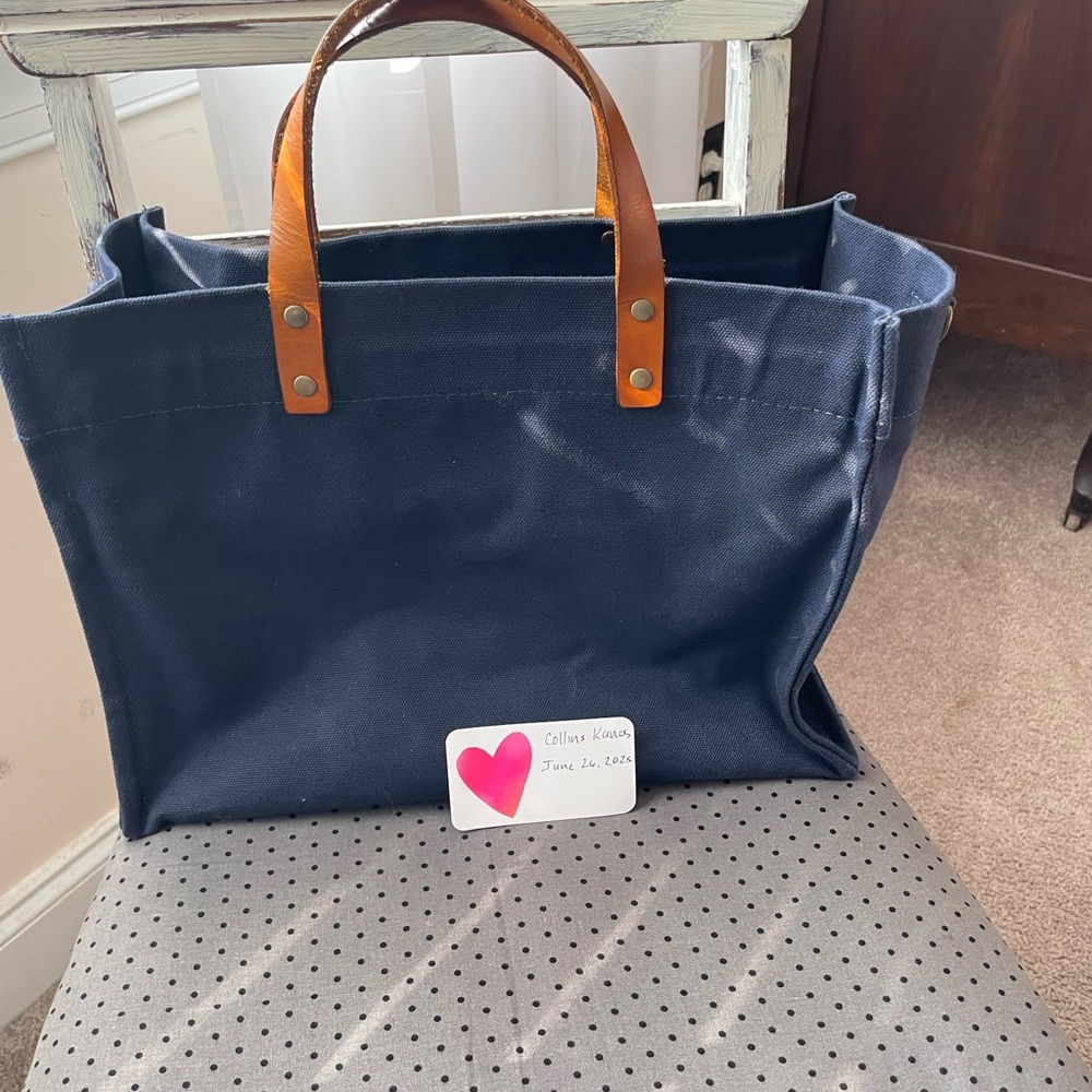Parker Thatch Navy Canvas Tote Bag with Brown Handles. It is one of the original